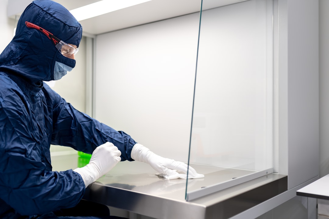 Laboratory personnel cleaning laboratory